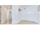 Bright hallway with a double door leading to another room at 1520 Gulf Blvd # 1602, Clearwater Beach, FL 33767