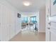 Bright hallway leading into an open-concept living room with large windows offering water views at 1520 Gulf Blvd # 1602, Clearwater Beach, FL 33767