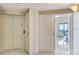Hallway with door leading to the living room with ocean views and a door to the elevator at 1520 Gulf Blvd # 1602, Clearwater Beach, FL 33767