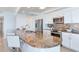 Contemporary kitchen with granite countertops, stainless steel appliances, and a convenient breakfast bar at 1520 Gulf Blvd # 1602, Clearwater Beach, FL 33767