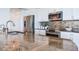 Gourmet kitchen featuring granite countertops, stainless steel appliances, and stylish backsplash at 1520 Gulf Blvd # 1602, Clearwater Beach, FL 33767