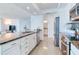 Open kitchen with granite counters, stainless appliances, and seamless flow to living spaces at 1520 Gulf Blvd # 1602, Clearwater Beach, FL 33767