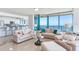 Bright, airy living room with floor-to-ceiling windows showcasing beautiful ocean views at 1520 Gulf Blvd # 1602, Clearwater Beach, FL 33767