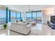 Bright living room featuring expansive windows with ocean views and comfortable seating at 1520 Gulf Blvd # 1602, Clearwater Beach, FL 33767