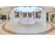 Bright lobby features neutral tile floors, tall columns, and indoor planters at 1520 Gulf Blvd # 1602, Clearwater Beach, FL 33767