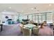 Common resident lounge with ample seating, tables, and natural light at 1520 Gulf Blvd # 1602, Clearwater Beach, FL 33767