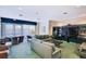 Community lounge features comfortable sofas, tv, fireplace, and a wall of bookshelves at 1520 Gulf Blvd # 1602, Clearwater Beach, FL 33767