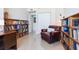 Bright office featuring a chair, bookshelves, and doorway at 1520 Gulf Blvd # 1602, Clearwater Beach, FL 33767