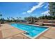 The community pool is surrounded by palm trees with plenty of room for lounging at 1520 Gulf Blvd # 1602, Clearwater Beach, FL 33767