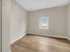 Bright bedroom with wood-look floors and a window offering natural light at 1740 W Cherry St, Tampa, FL 33607