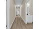 Bright hallway with neutral walls and hardwood flooring at 1740 W Cherry St, Tampa, FL 33607