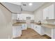 Well-equipped kitchen featuring white Shaker cabinets and granite countertops at 1740 W Cherry St, Tampa, FL 33607