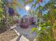 Spacious backyard with patio, seating area, and lush tropical plants at 2606 46Th S St, Gulfport, FL 33711