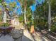 Landscaped backyard oasis with patio furniture and shed at 2606 46Th S St, Gulfport, FL 33711