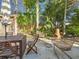 Private backyard with patio, fire pit, and lush landscaping at 2606 46Th S St, Gulfport, FL 33711