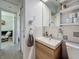 Clean bathroom with modern vanity, toilet, and shelving at 2606 46Th S St, Gulfport, FL 33711