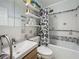 Clean bathroom, featuring a shower/tub combo and stylish tile at 2606 46Th S St, Gulfport, FL 33711