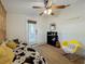 Bedroom with daybed, yellow rocking chair, and bookcase at 2606 46Th S St, Gulfport, FL 33711