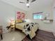 Charming bedroom with a cowhide print comforter and unique wall decor at 2606 46Th S St, Gulfport, FL 33711