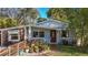Charming bungalow with colorful landscaping and a welcoming front porch at 2606 46Th S St, Gulfport, FL 33711