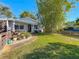 Well-maintained house exterior with lush landscaping and potted plants at 2606 46Th S St, Gulfport, FL 33711