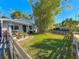Landscaped front yard with wooden fence at 2606 46Th S St, Gulfport, FL 33711
