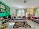 Living room with gallery wall, comfy seating, and a large window at 2606 46Th S St, Gulfport, FL 33711