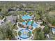 Community pool, tennis courts, and playground from above at 27544 Kirkwood Cir, Wesley Chapel, FL 33544