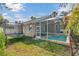 Large backyard with a pool and trampoline at 27544 Kirkwood Cir, Wesley Chapel, FL 33544