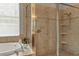 Bright bathroom with a walk-in shower and tile surround at 27544 Kirkwood Cir, Wesley Chapel, FL 33544