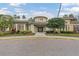 Community clubhouse with inviting entryway and landscaping at 27544 Kirkwood Cir, Wesley Chapel, FL 33544