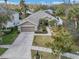 Attractive single-story home with a landscaped yard and two-car garage at 27544 Kirkwood Cir, Wesley Chapel, FL 33544