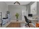 Convenient home office with built-in shelving and exterior access at 27544 Kirkwood Cir, Wesley Chapel, FL 33544