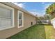 Side view of house showcasing landscaping at 27544 Kirkwood Cir, Wesley Chapel, FL 33544