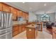 Spacious kitchen with island, stainless steel appliances, and wood cabinets at 27544 Kirkwood Cir, Wesley Chapel, FL 33544