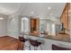 Spacious kitchen with granite countertops, stainless steel appliances, and wood cabinets at 27544 Kirkwood Cir, Wesley Chapel, FL 33544