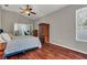 Large main bedroom with hardwood floors and access to private office at 27544 Kirkwood Cir, Wesley Chapel, FL 33544