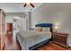 Main bedroom with hardwood floors and access to bathroom at 27544 Kirkwood Cir, Wesley Chapel, FL 33544