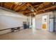 Unfinished basement with high ceilings, concrete floor, and laundry area at 3034 Domino Dr, Holiday, FL 34691