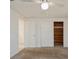 Bedroom with carpet flooring, double closets, and access to a bathroom at 3034 Domino Dr, Holiday, FL 34691
