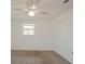 Simple bedroom with carpet, ceiling fan, and a window at 3034 Domino Dr, Holiday, FL 34691