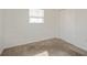 Bright bedroom with carpet, window, and closet at 3034 Domino Dr, Holiday, FL 34691
