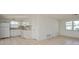 Efficient kitchen with white cabinets and appliances at 3034 Domino Dr, Holiday, FL 34691