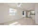 Bright kitchen with white cabinets and access to patio at 3034 Domino Dr, Holiday, FL 34691