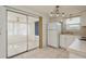 Kitchen features white cabinets and access to patio at 3034 Domino Dr, Holiday, FL 34691