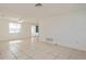 Bright living room featuring tile floors and a ceiling fan at 3034 Domino Dr, Holiday, FL 34691