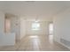 Spacious living room with tile floors and plenty of natural light at 3034 Domino Dr, Holiday, FL 34691