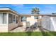 Small patio with chairs and a shed next to the house at 3034 Domino Dr, Holiday, FL 34691
