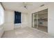 Sunroom with kitchen view, tile floors, and sliding glass doors at 3034 Domino Dr, Holiday, FL 34691