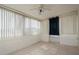 Sunroom with tile floor, window blinds, and a ceiling fan at 3034 Domino Dr, Holiday, FL 34691